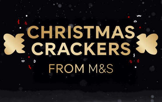 A logo that reads "Christmas Crackers From M&S". Gold text on a black background with snow falling down